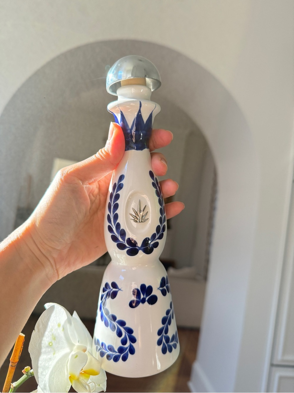 Hand-Painted Blue and White Ceramic Bottle with Silver Stopper